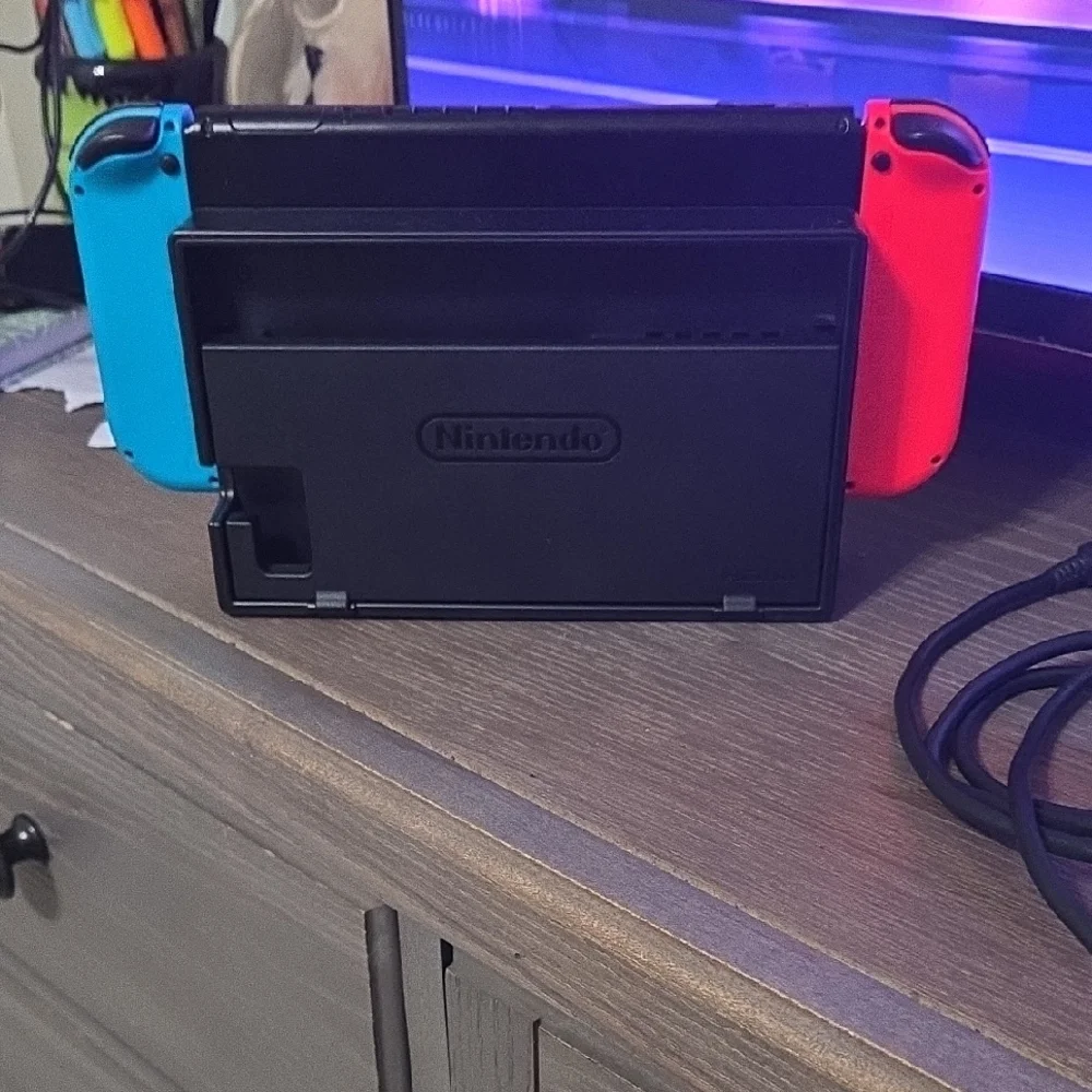 Nintendo Console with Vibrant Red and Blue Controllers